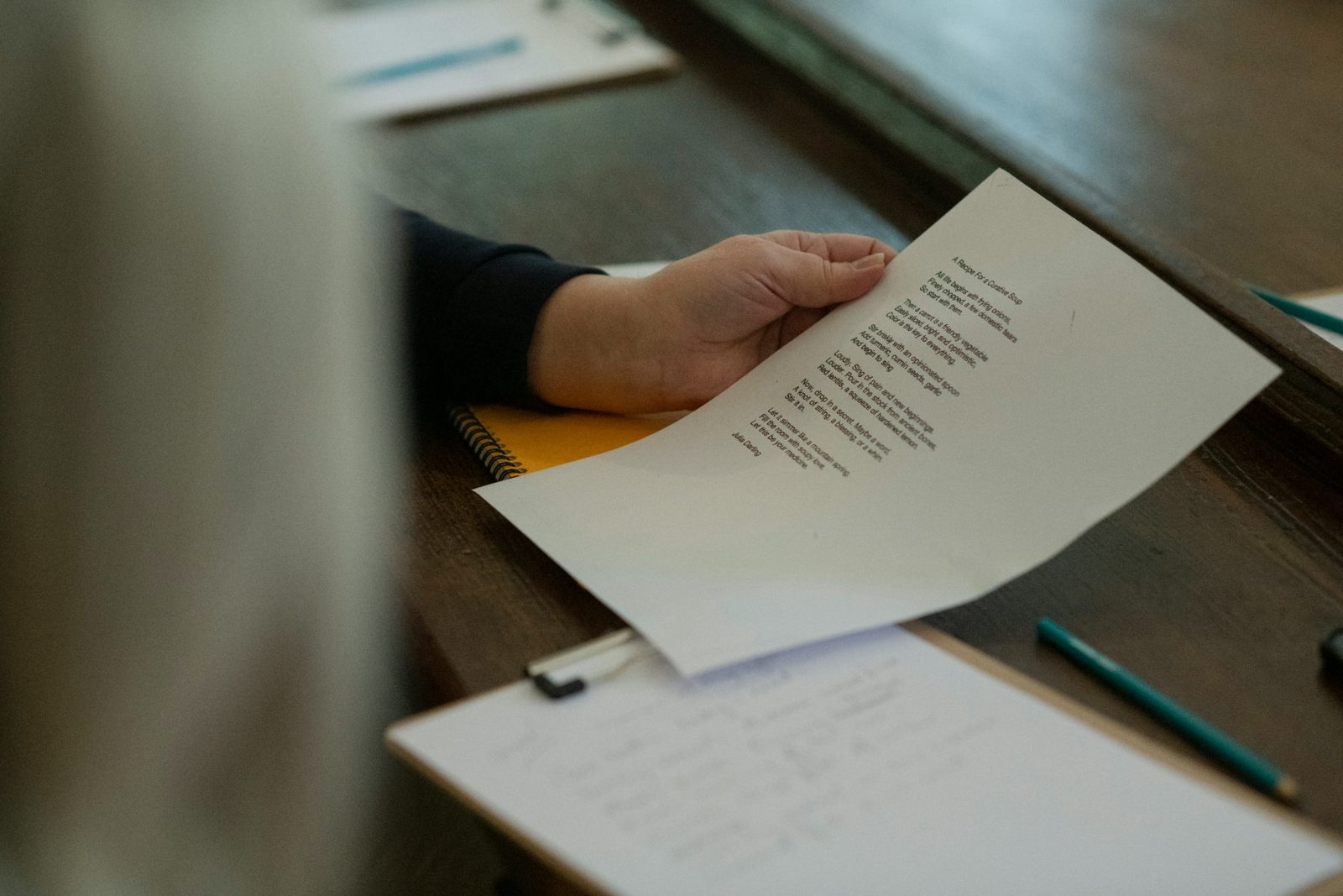 A printed report being read at a desk